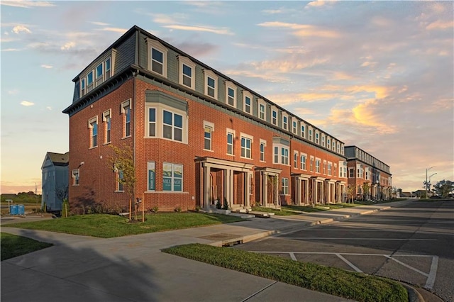 view of outdoor building at dusk