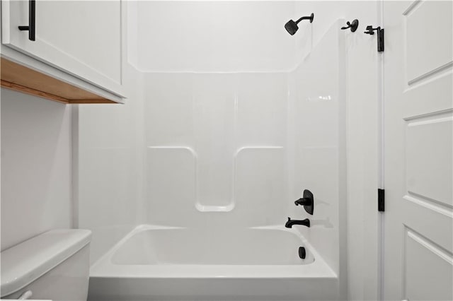 bathroom featuring toilet and shower / washtub combination