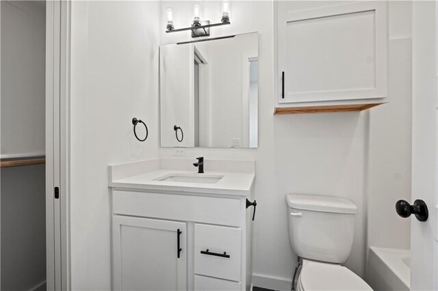 full bathroom featuring vanity, plus walk in shower, and toilet