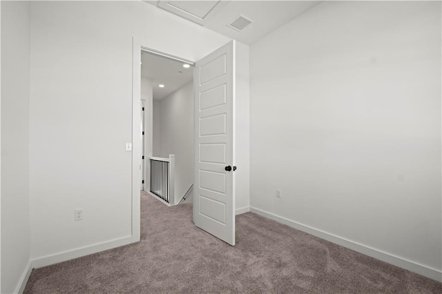 unfurnished bedroom with light colored carpet