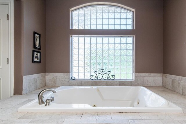 1709 Lake Alvamar Dr, Lawrence, KS 66047 - bathroom with a jetted tub and plenty of natural light