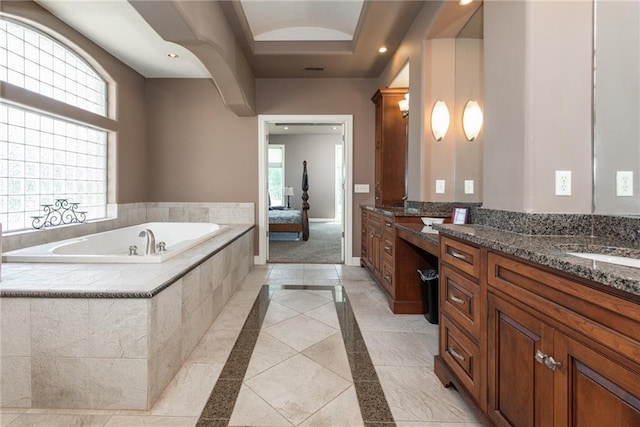 1709 Lake Alvamar Dr, Lawrence, KS 66047 - ensuite bathroom with a garden tub, connected bathroom, a raised ceiling, vanity, and recessed lighting