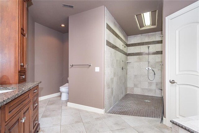 1709 Lake Alvamar Dr, Lawrence, KS 66047 - bathroom with walk in shower, toilet, baseboards, and vanity