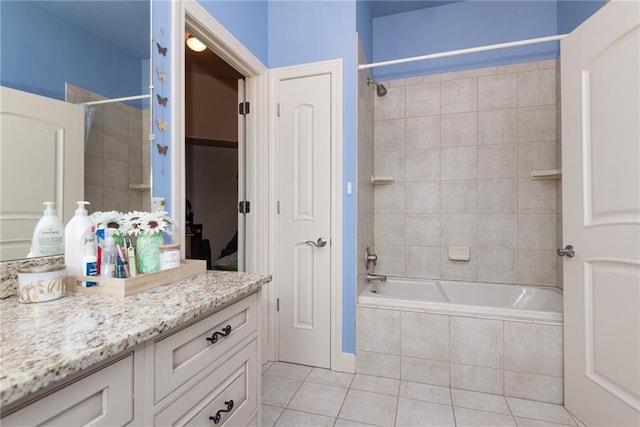 1709 Lake Alvamar Dr, Lawrence, KS 66047 - full bath featuring vanity, tiled shower / bath combo, and tile patterned floors
