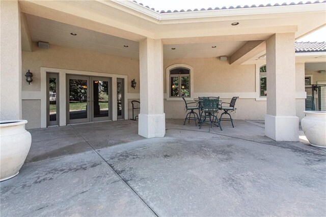 1709 Lake Alvamar Dr, Lawrence, KS 66047 - view of patio featuring outdoor dining area and french doors