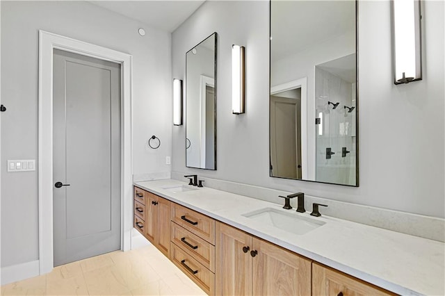 bathroom featuring a shower and vanity