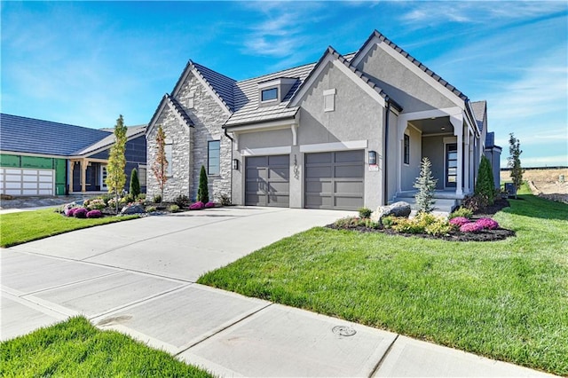 view of front of home featuring concrete driveway, stone siding, stucco siding, an attached garage, and a front yard