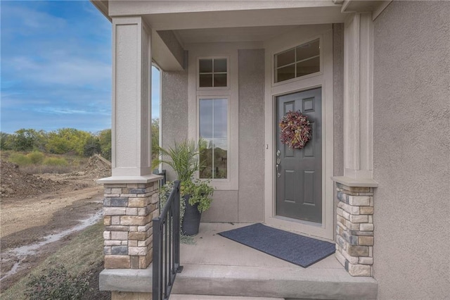 property entrance with covered porch