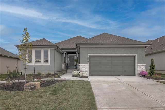 view of front facade with a front yard and a garage