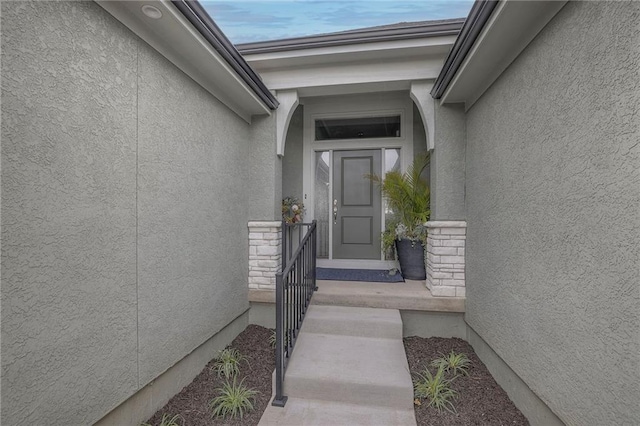 12200 W 138th Pl, Overland Park, KS 66221 - doorway to property featuring stucco siding