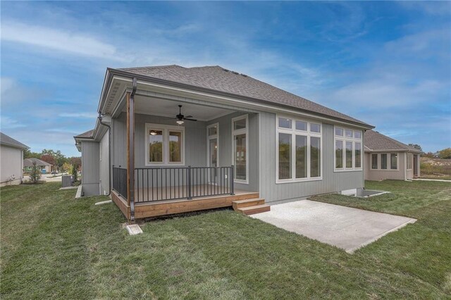 12200 W 138th Pl, Overland Park, KS 66221 - back of house with ceiling fan, a yard, a patio, and roof with shingles