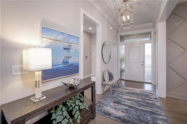 12200 W 138th Pl, Overland Park, KS 66221 - entrance foyer with a chandelier, wood finished floors, and crown molding