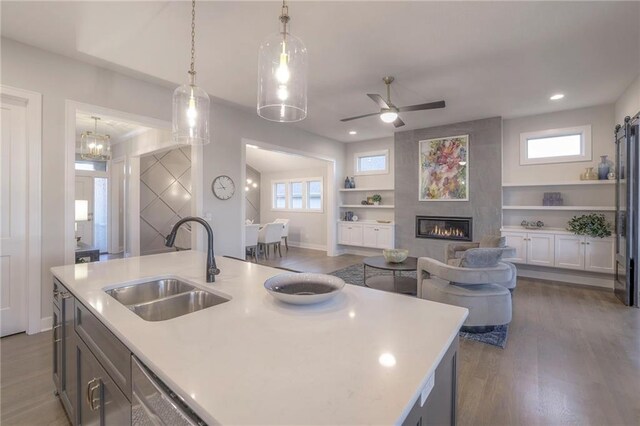 12200 W 138th Pl, Overland Park, KS 66221 - kitchen with a sink, open floor plan, light countertops, plenty of natural light, and recessed lighting