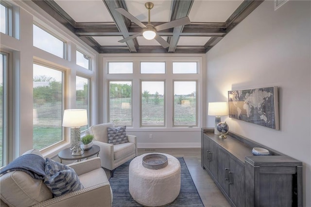 12200 W 138th Pl, Overland Park, KS 66221 - living area with healthy amount of natural light, ceiling fan, wood finished floors, beamed ceiling, and coffered ceiling