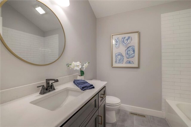 12200 W 138th Pl, Overland Park, KS 66221 - bathroom featuring vanity, lofted ceiling, tile patterned floors, toilet, and baseboards