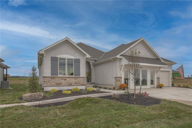 13812 Quigley St, Overland Park, KS 66221 - ranch-style house with stone siding, concrete driveway, a garage, stucco siding, and a front lawn