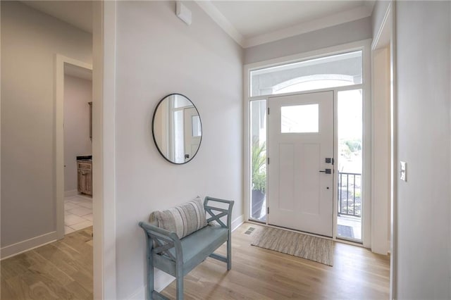 13812 Quigley St, Overland Park, KS 66221 - entrance foyer with healthy amount of natural light, wood finished floors, and baseboards