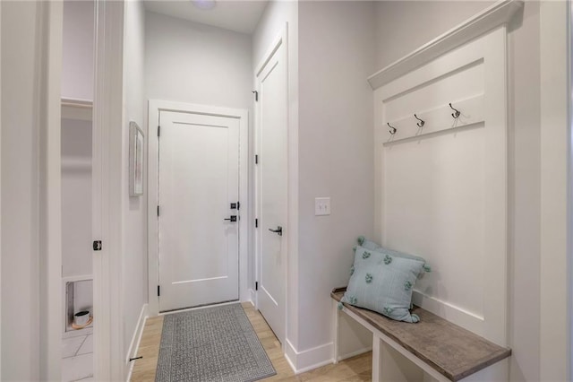 13812 Quigley St, Overland Park, KS 66221 - mudroom featuring baseboards and light wood-style floors
