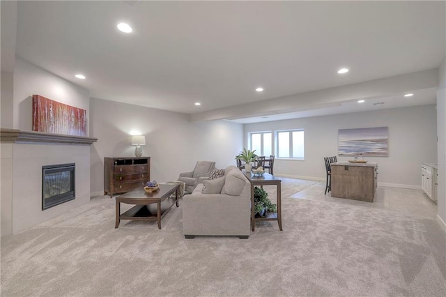 13812 Quigley St, Overland Park, KS 66221 - carpeted living area featuring recessed lighting, baseboards, and a tiled fireplace