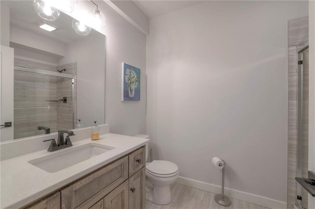 13812 Quigley St, Overland Park, KS 66221 - bathroom with toilet, vanity, a tile shower, and baseboards