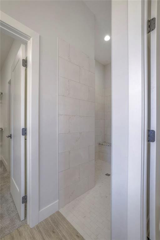 13812 Quigley St, Overland Park, KS 66221 - full bathroom featuring baseboards, walk in shower, wood finished floors, and recessed lighting
