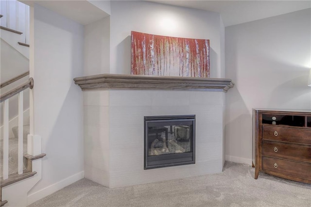 13812 Quigley St, Overland Park, KS 66221 - detailed view of carpet, a glass covered fireplace, and baseboards