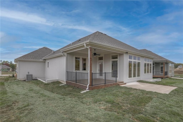 13812 Quigley St, Overland Park, KS 66221 - back of property with a ceiling fan, a yard, a patio area, and roof with shingles