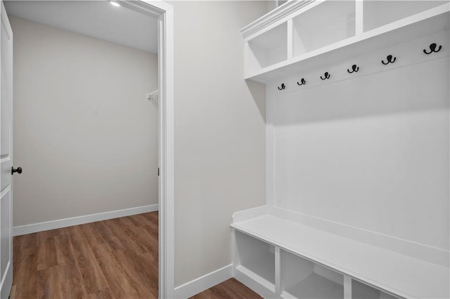 mudroom featuring baseboards and wood finished floors