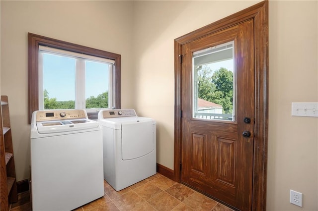 clothes washing area featuring independent washer and dryer and light tile floors