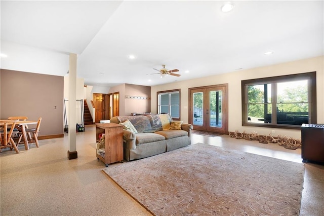 living room featuring ceiling fan and french doors