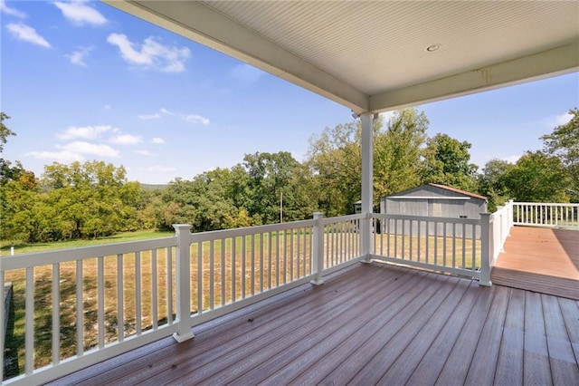 wooden deck with a shed