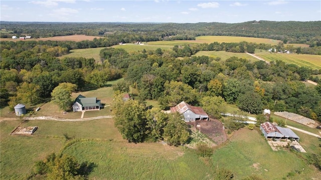 birds eye view of property with a rural view