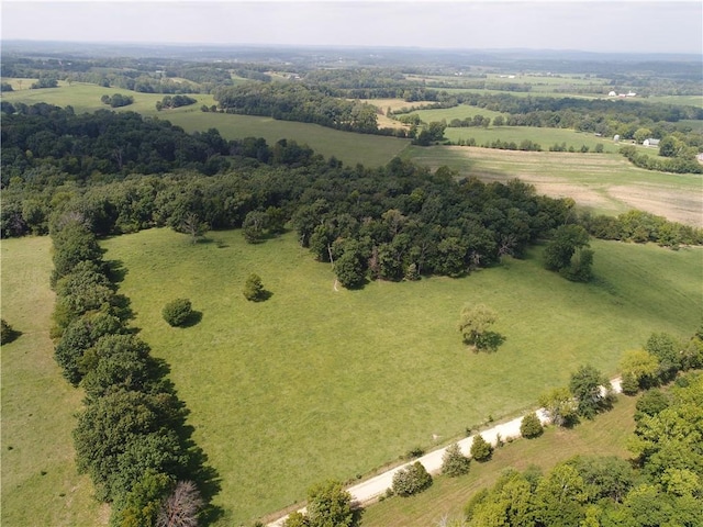 birds eye view of property featuring a rural view