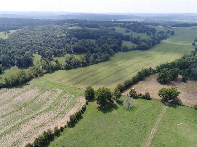 birds eye view of property with a rural view