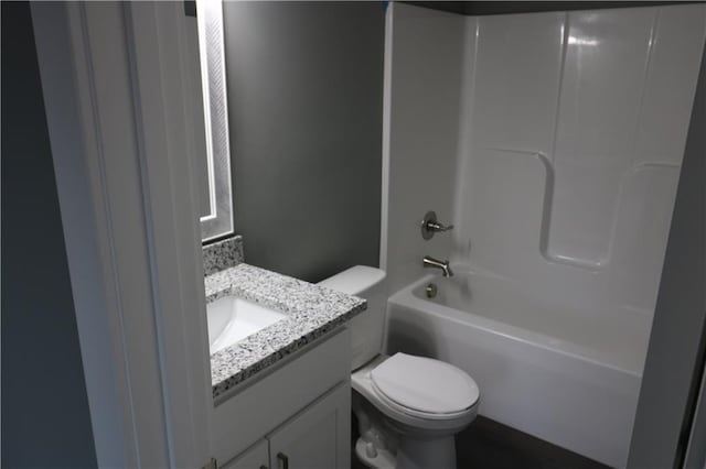 full bathroom featuring vanity, toilet, and shower / washtub combination