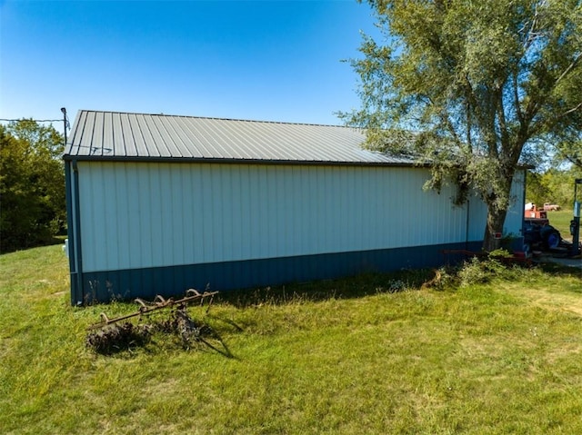 view of home's exterior with a yard