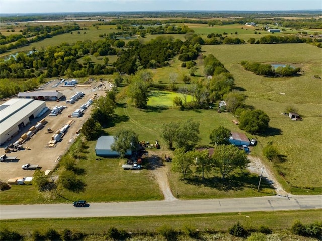 birds eye view of property with a rural view