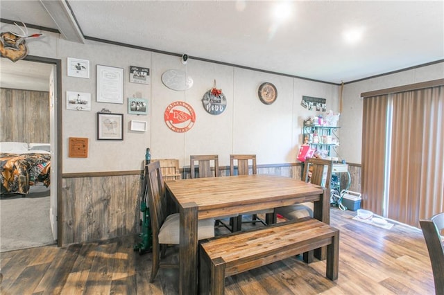 dining space with dark hardwood / wood-style flooring