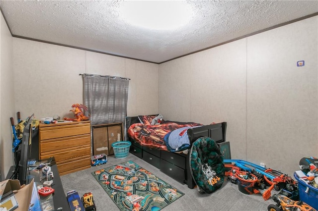 bedroom with a textured ceiling and carpet