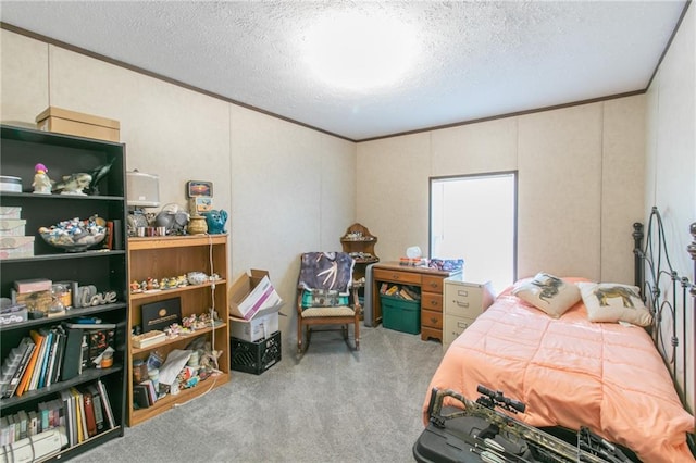 bedroom with a textured ceiling and light carpet