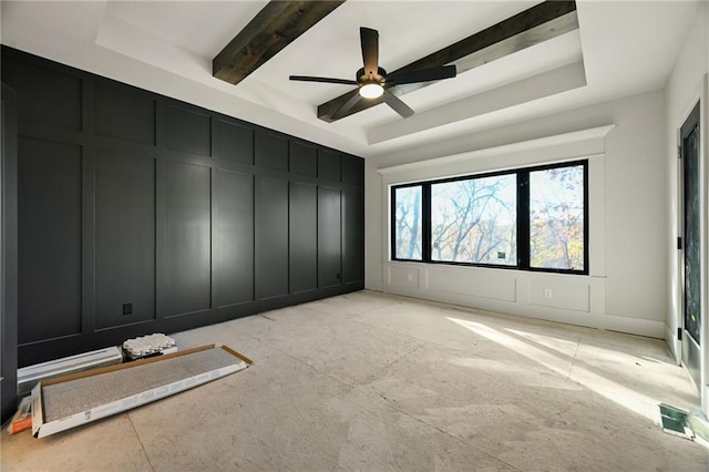 111 Teton Rdg, Lake Winnebago, MO 64034 - unfurnished bedroom with a decorative wall, a tray ceiling, a ceiling fan, and beam ceiling