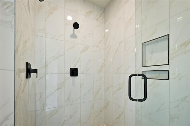 bathroom featuring an enclosed shower