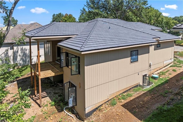 view of side of property with a deck