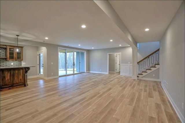 unfurnished living room featuring light hardwood / wood-style floors