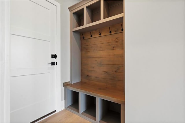 mudroom with light wood finished floors