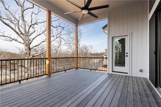 wooden deck with a ceiling fan