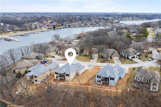 bird's eye view with a water view and a residential view