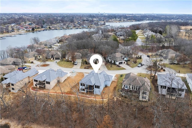 birds eye view of property featuring a water view and a residential view