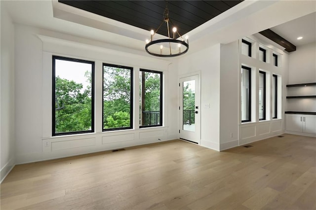 119 Teton Rdg, Lake Winnebago, MO 64034 - unfurnished room featuring light wood-type flooring, a chandelier, recessed lighting, and a tray ceiling