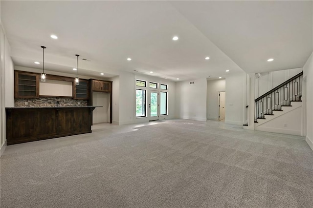 119 Teton Rdg, Lake Winnebago, MO 64034 - unfurnished living room with recessed lighting, light carpet, and stairs